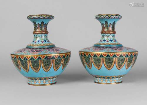 A pair of Chinese cloisonne archaistic garlic-head vases, 19th century, decorated with bands of ruyi heads, stiff leaves, and archaic motifs, on a pale blue ground, unmarked, 23cm high