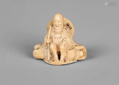 A fine Japanese ivory netsuke, early 19th century, carved as a pilgrim resting on a log, unsigned, 3.7cm high