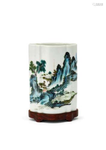 A Chinese porcelain quatrefoil brush pot, Zhende Tang zhi hall mark, late Qing dynasty, finely painted in enamels with a figure in a mountainous landscpae, fitted hardwood stand, 12.5cm high
