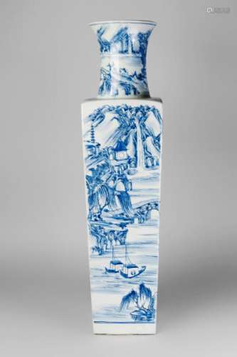 A very large Chinese porcelain square vase, Kangxi period, the body slightly tapering, below a waisted neck with flared mouth, painted throughout in underglaze blue with a continuous extensive village landscape, with mountains and fisherman, unglazed broad foot with recessed unmarked base, 80cm high
