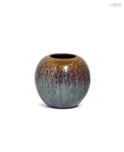 A Chinese grey stoneware flambé water pot, Yongzheng mark and period, of globular form, with mottled olive green glaze around mouth, and rich streaked reddish-purple glaze body, mottled cafe-au-lait glaze over impressed four-character seal mark to base, 7cm high Provenance: Private London Collection Cf. Christie's, South Kensington, Chinese Ceramics, Works of Art, and Textiles Part I, 4th November 2014, Lot 222 for a similar pot
