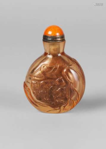 A Chinese rock crystal snuff bottle, late Qing dynasty, carved in low relief with a birds amidst pine trees, orange hardstone stopper, 6.5cm high