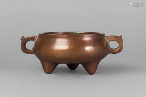 A Chinese bronze tripod censer, Kangxi mark, 19th/early 20th century, of typical bombe form, with archaistic handles, 15.5cm wide, 1267 grams