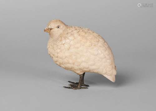 A Japanese ivory okimono, Meiji period, finely carved as a quail with corn in its beak, with bronze feet, unsigned, 9cm high, 10cm long