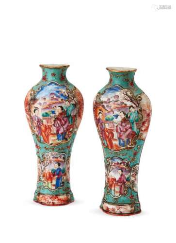 A rare pair of Chinese export porcelain vase-shaped famille rose wall pockets, Qianlong period, each set with panels painted with various figures at court, inside a raised scroll border on a turquoise glazed ground, 20cm high Provenance: Private London collection
