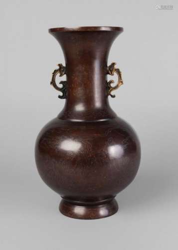 A Chinese bronze and silver inlaid bottle vase, 19th century, with flared mouth and stylised dragon handles to neck, the body inlaid with figures playing instruments and cranes flying above, indistinct character marks to base, 31cm high