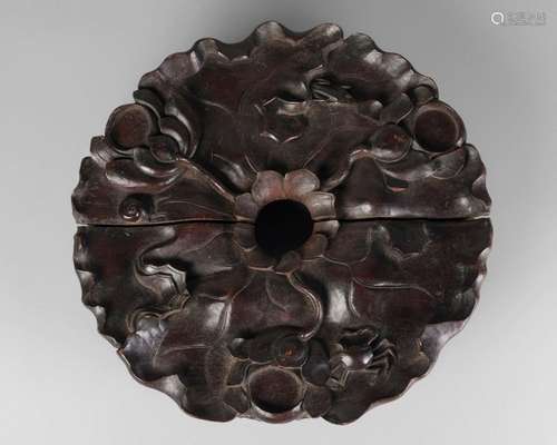 A large Chinese hardwood censer stand, 19th century, carved as a lotus flower, the frieze carved with blossoming prunus, 40cm diameter