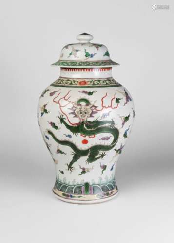 A Chinese porcelain famille verte jar and cover, Qianlong mark, 19th century, painted in enamels with two dragons amidst cloud wisps, underglaze blue four character mark within a double ring, 44cm high