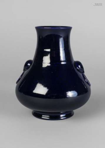 A Chinese porcelain monochrome vase, Qianlong mark, 20th century, with allover aubergine glaze, moulded with bear mask and ring handles, impressed seal mark to base, 15cm high