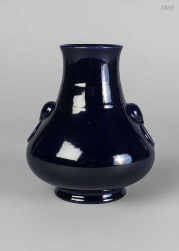 A Chinese porcelain monochrome vase, Qianlong mark, 20th century, with allover aubergine glaze, moulded with bear mask and ring handles, impressed seal mark to base, 15cm high