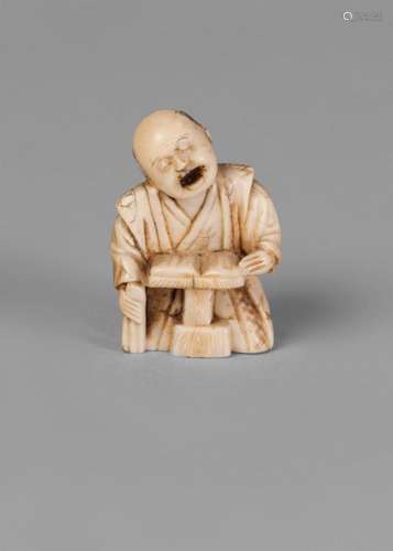 A Japanese ivory netsuke, Meiji period, carved as a kneeling figure reading, 4cm high