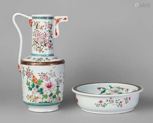 A Chinese porcelain famille rose ewer and basin, Qianlong period, the ewer with strap handle and angular spout, both painted in enamels with butterflies and chrysanthemum sprays, 35cm height of ewer, 26cm diameter of basin (2)