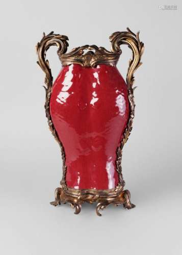 A Chinese porcelain sang de boeuf glazed double fish vase, Qing dynasty, 19th century, with 19th century French gilt bronze mounts, 47cm high