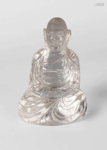 A Chinese rock crystal carving of Amitayus, early 20th century, seated in dhyanasana and with hands in dhyana mudra, 15cm high