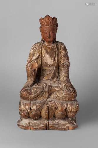 A Chinese giltwood carving of Amitayus, 18th/19th century, seated in dhyasana, with left palm resting on left knee, wearing crown carved with seated deities, on lotus throne, traces of gilt painted moulded gesso, inscription to reverse, 42cm high