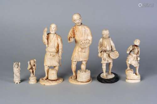 Five Japanese ivory okimono, Meiji period, carved as artisans and a fisherman, 7.5cm - 21.5cm high, and a Japanese ivory netsuke of a woman carrying a child, 7cm high (6)