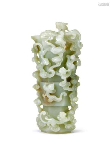 A Chinese pale celadon jade beaker vase, Gu, 17th century, of six-sided compressed archaic form, finely carved with nine dragons amid meandering clouds, the pale celadon stone of even tone, with light brown inclusion to raised mid-section, 24.5cm high, on later wood stand Provenance: Christie's Swire 1st April '92 Lot 1211 The T.b. Walker Foundation, Minneapolis Notes: Whilst the number nine is auspicious in Chinese folk beliefs, the depiction here probably refers to the nine sons of the Drago