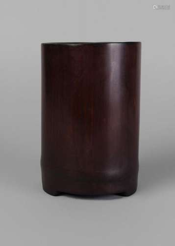 A Chinese bamboo brush pot, 19th century, of plain form, with three stepped feet, 17cm high