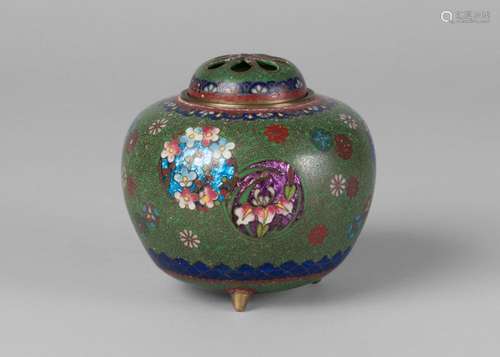 A Japanese cloisonne globular censer, c.1900, decorated with floral roundels on a green ground, on three short feet, 9cm high