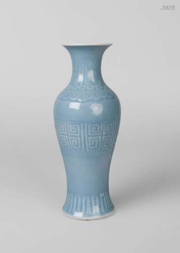 A Chinese porcelain claire de lune baluster vase, Qianlong mark, late 19th century, decorated with vertical stiff leaves to neck above band of ruyi heads and a band of geometric motifs to body, underglaze blue six-character mark to base, 25.5cm high