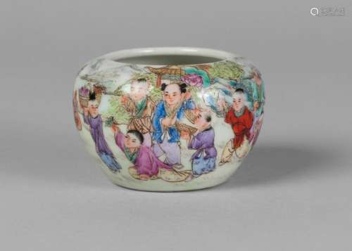 A Chinese porcelain water pot, Republic period, finely painted with a procession of boys, some carrying lotus, a peach, and instruments, iron red seal mark to base, 4cm high, 6.5cm diameter