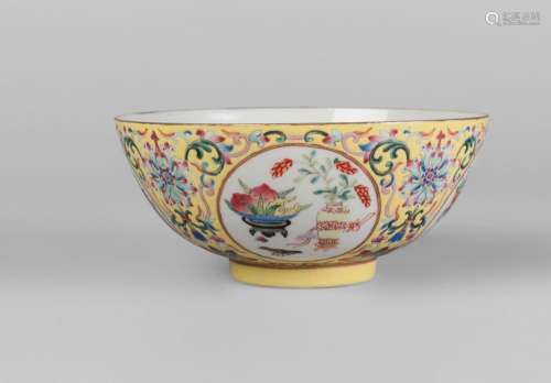 A Chinese porcelain medallion bowl, probably Republic period, painted in famille rose enamels with four circular panels decorated with auspicious objects, on a yellow ground decorated with scrolling lotus blooms, iron red four character mark to base, 6cm high, 14cm diameter