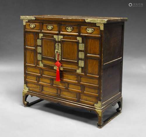 A Korean softwood cabinet, late 19th century, with four frieze drawers above pair of central cupboard doors, 100cm x 100cm x 46cm