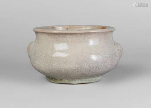 A Chinese white glazed stoneware censer, Qianlong period, of circular bombe form, moulded with lion mask handles, unglazed recessed base, 9cm high, 17cm wide