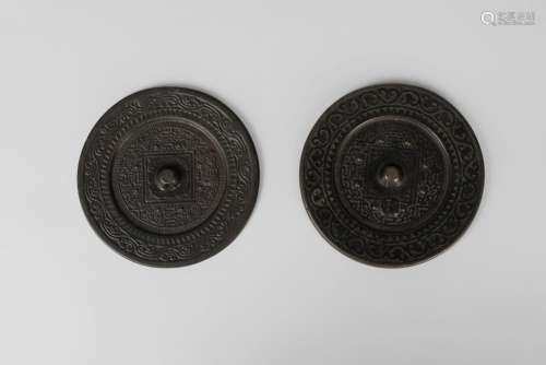 Two Chinese bronze Han style 'TVL' type mirrors, 20th century, one cased, 11cm diameter