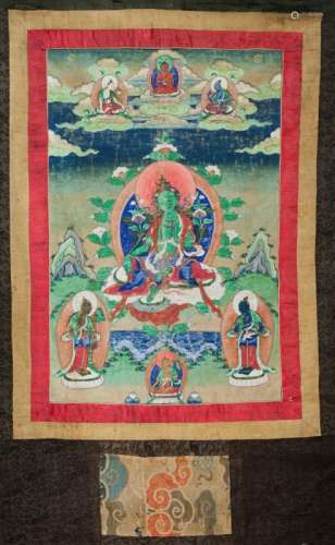 A Tibetan thangka, 19th century, centred with Green Tara, seated, with lotus stems issuing from her palms, beneath three deities amidst clouds, and three Earth deities, 61cm x 40cm, and a Chinese calligraphy scroll (2)