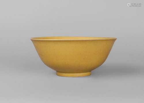 A Chinese porcelain monochrome bowl, Qianlong mark, 20th century, of ogee form, with allover pale yellow glaze, white glazed base, paper collection label to base, 17.5cm diameter, 7cm high