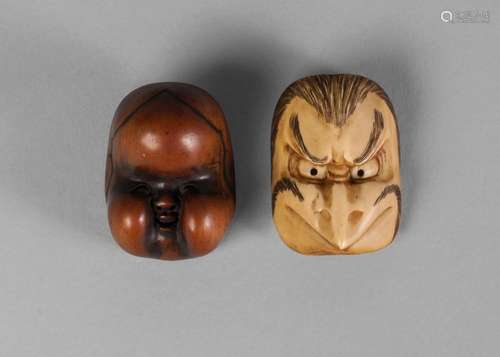 Two Japanese noh mask netsuke, early 20th century, one carved in boxwood, the other ivory, 3.5cm and 4cm long