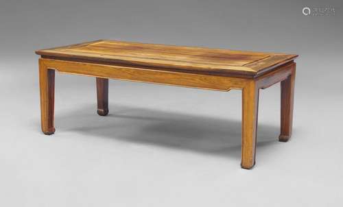 A Chinese huali wood Ming style table, late 19th/early 20th century, the rectangular top raised on square supports, 42cm x 113cm x 55.5cm