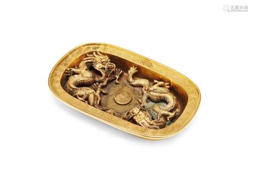 A rare Chinese gilt bronze cup stand, Qianlong, finely cast to the interior with two confronting dragons around a flaming pearl inside a Greek key decorated rim, unmarked, 968 grams, 17cm wide