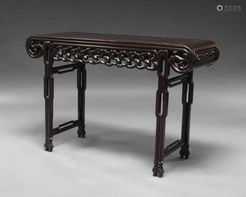 A Chinese hardwood scroll table, late Qing Dynasty, with scroll ends and carved knot-design frieze, 83cm x 126cm x 43cm