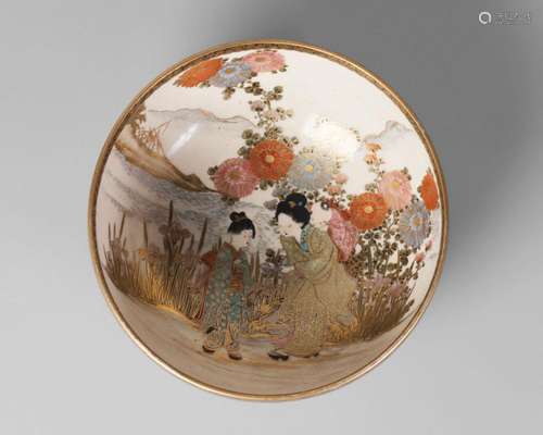 A Japanese Satsuma bowl, early 20th century, painted with a woman and two children in a landscape amidst orchids, and bamboo to the exterior, signed, 17.5cm diameter, 6.5cm high