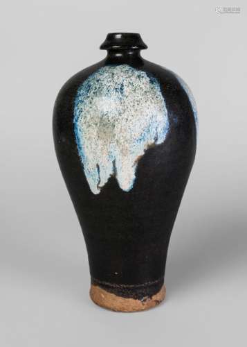 A Chinese phosphatic-splashed meiping, Tang Dynasty, with rich dark glaze and two blue-white splashes to the shoulder, unglazed base, 27cm high Provenance: Private south of England collection