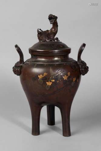 A Japanese bronze tripod koro and cover, Meiji period, the cover cast with a kylin, the base incised and inlaid with with a boy with two chickens, and a bird amidst a blossoming sprig, with cast lion mask handles, 30cm high