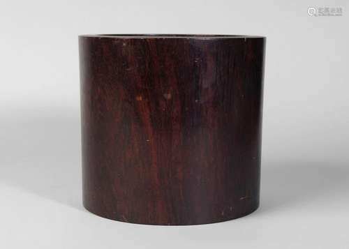 A Chinese dark huali wood bitong, late 18th/early 19th century, the wood of rich dark tone, with plug to base, 16cm high, 18cm diameter