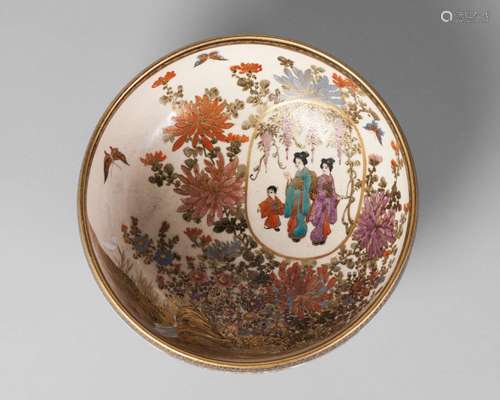 A Japanese Satsuma bowl by Shozan, Meiji period, painted with two women and a boy inside a panel, set within a landscape of butterflies amidst chrysanthemum, and with wisteria to the exterior, 15cm diameter, 6cm high