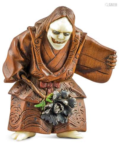 NETSUKE: SCHAUSPIELER MIT HANNYA MASKE. Japan. Meiji-Zeit. Spätes 19. Jh. Kirschholz mit fein