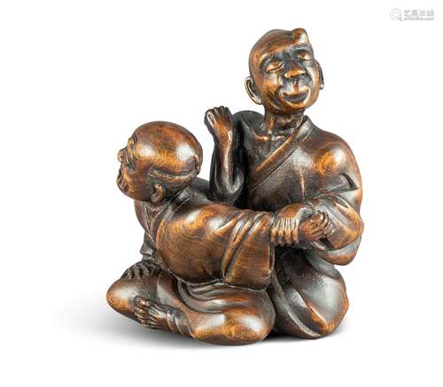 NETSUKE: BLINDER MASSEUR. Japan. Edo-Zeit. Mitte 19. Jh. Buchsbaum, dunkel eingefärbt, mit schöner