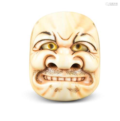 NETSUKE: BUAKU MASKE. Japan. Edo-Zeit. Mitte 19. Jh. Elfenbein mit fein geschnitzten und gravierten,