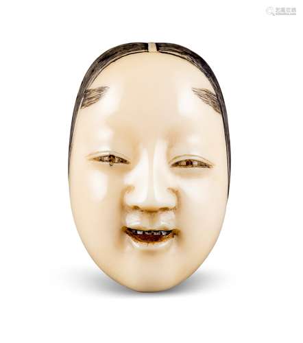 NETSUKE: KO-OMOTE MASKE. Japan. Edo-Zeit. 19. Jh. Elfenbein mit fein gravierten, dunkel