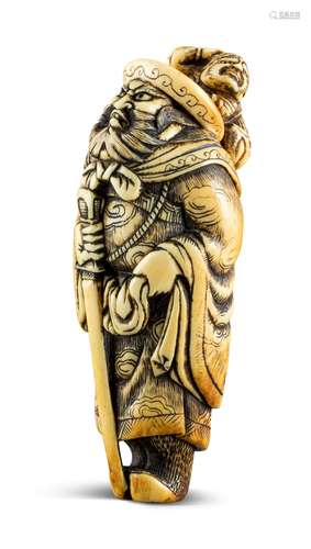 NETSUKE: MÄCHTIGER SHÔKI. Japan. Edo-Zeit. Spätes 18. Jh. Elfenbein. Mächtiger Shôki in langem,