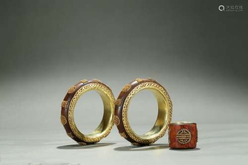 A pair of gold-bead inlaid agarwood bangles and archer's ring