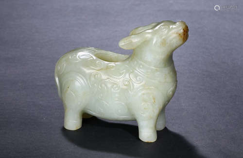 A white jade archaistic tapir-form vessel