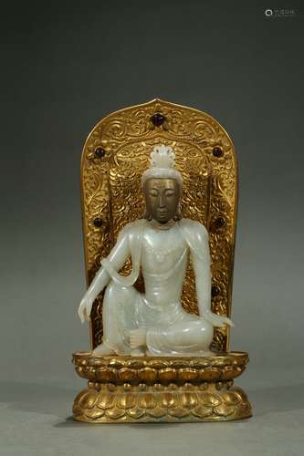 A white jade gilt-painted deity with backsplat