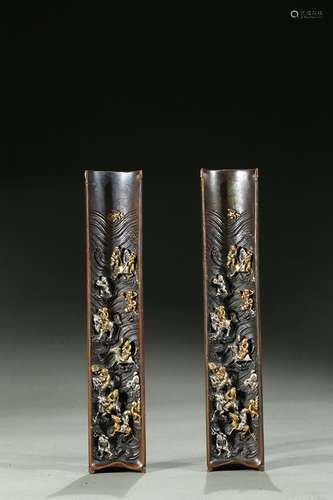 A pair of bronze silver inlaid 'immortals' paperweights