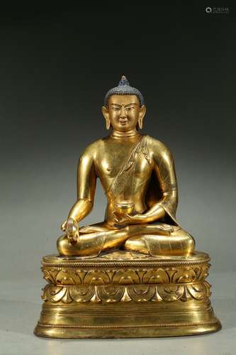 A gilt-bronze figure of medicine buddha